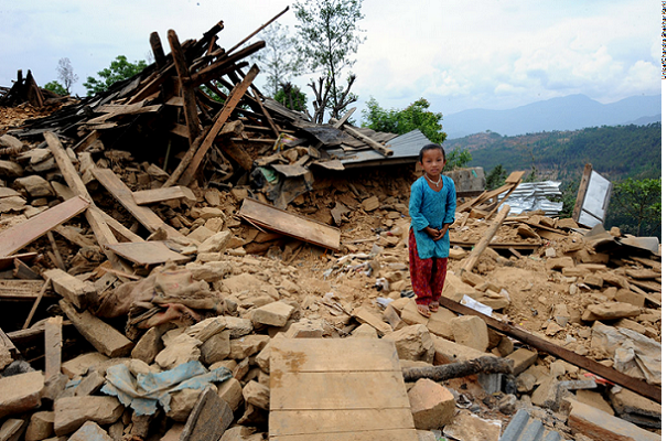 Akriti Tamang and rubble of her home in Nepal